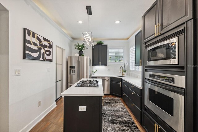 602 E Livingston St Unit 3, Orlando, FL 32803 - kitchen featuring stainless steel appliances, a kitchen island, light countertops, recessed lighting, and baseboards