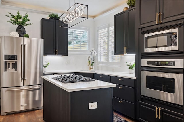 602 E Livingston St Unit 3, Orlando, FL 32803 - kitchen featuring stainless steel appliances, light countertops, a kitchen island, and a sink