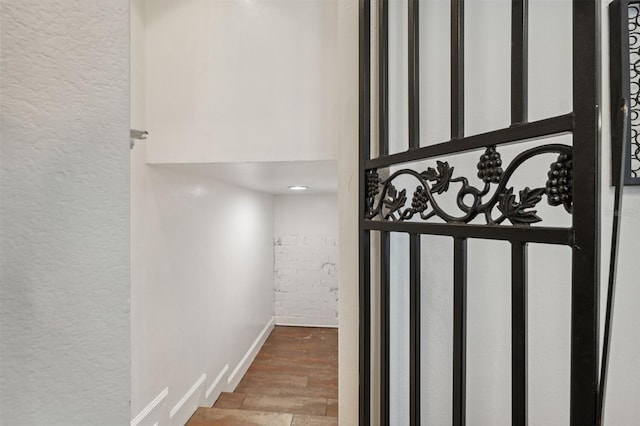 602 E Livingston St Unit 3, Orlando, FL 32803 - detailed view of wood finished floors, a textured wall, and baseboards