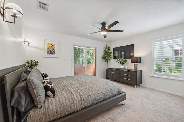 602 E Livingston St Unit 3, Orlando, FL 32803 - bedroom with multiple windows, baseboards, light colored carpet, and a ceiling fan