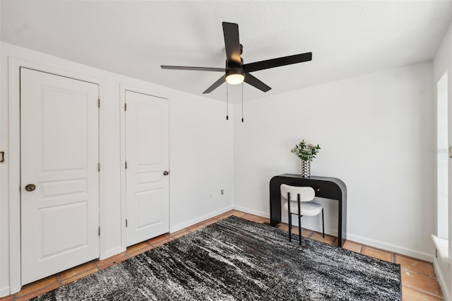602 E Livingston St Unit 3, Orlando, FL 32803 - unfurnished bedroom with a ceiling fan and baseboards