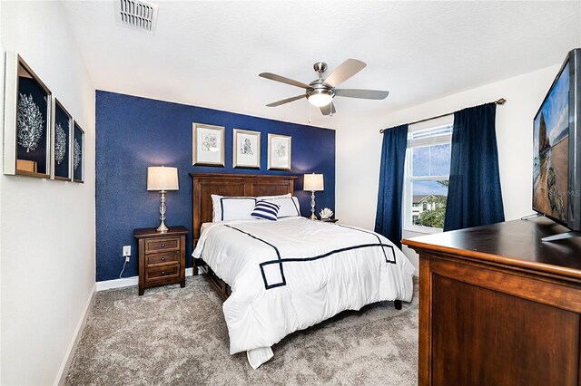 9106 Cut Shot Dr, Winter Garden, FL 34787 - carpeted bedroom with baseboards and ceiling fan