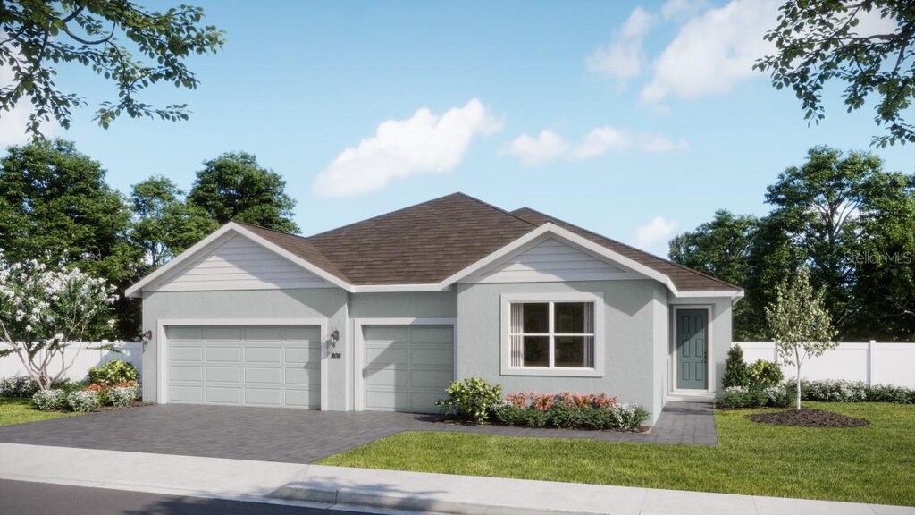 737 Farfields St, Deland, FL 32720 - single story home with a garage, decorative driveway, stucco siding, and a shingled roof
