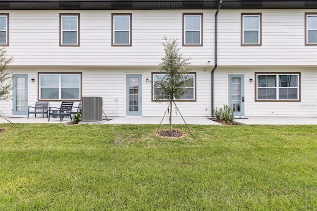 746 Longboat Dr, Davenport, FL 33896 - rear view of property featuring a patio and a yard
