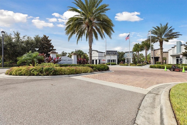 746 Longboat Dr, Davenport, FL 33896 - view of asphalt road featuring street lights, curbs, and a residential view
