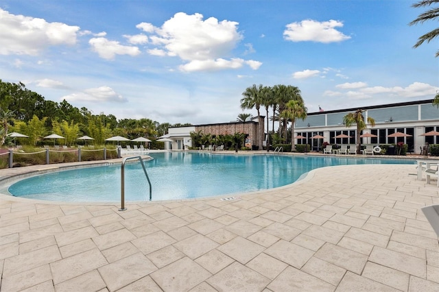 746 Longboat Dr, Davenport, FL 33896 - community pool featuring a patio