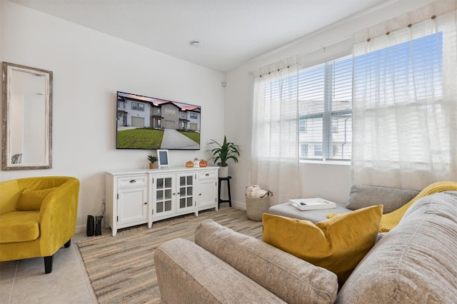 746 Longboat Dr, Davenport, FL 33896 - living area featuring light tile patterned floors and baseboards