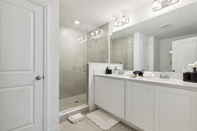746 Longboat Dr, Davenport, FL 33896 - full bathroom featuring double vanity, a stall shower, and tile patterned floors