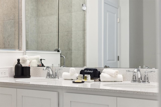 746 Longboat Dr, Davenport, FL 33896 - bathroom featuring double vanity and a tile shower