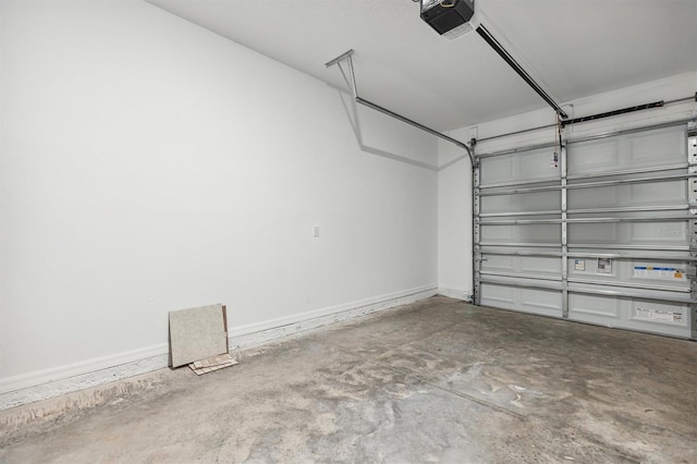 746 Longboat Dr, Davenport, FL 33896 - garage featuring baseboards and a garage door opener