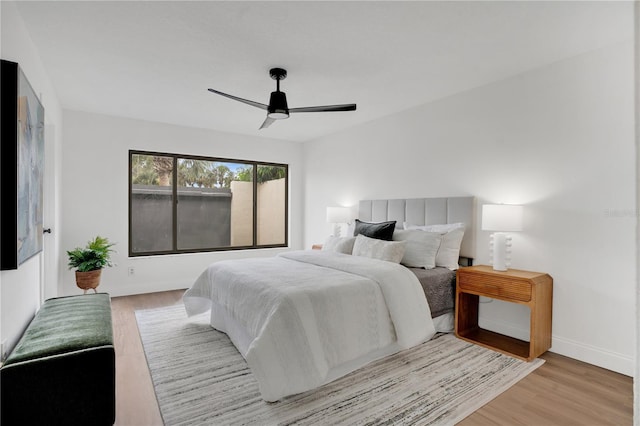 2541 Leeward Way, Winter Park, FL 32792 - bedroom with light wood-style floors, a ceiling fan, and baseboards