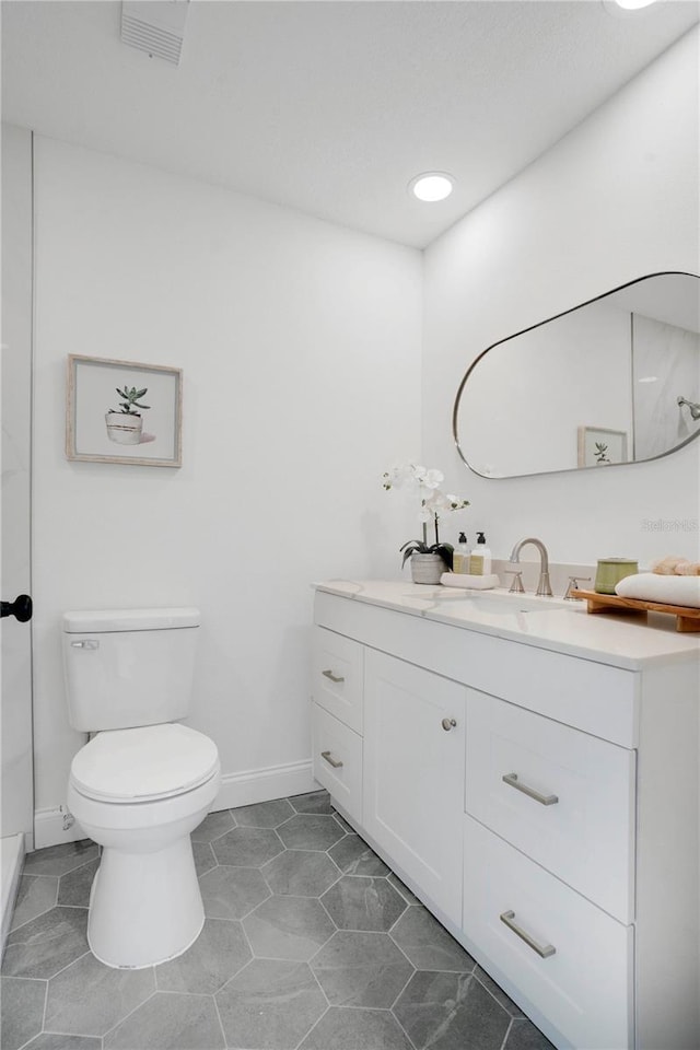 2541 Leeward Way, Winter Park, FL 32792 - bathroom featuring vanity, toilet, baseboards, and recessed lighting
