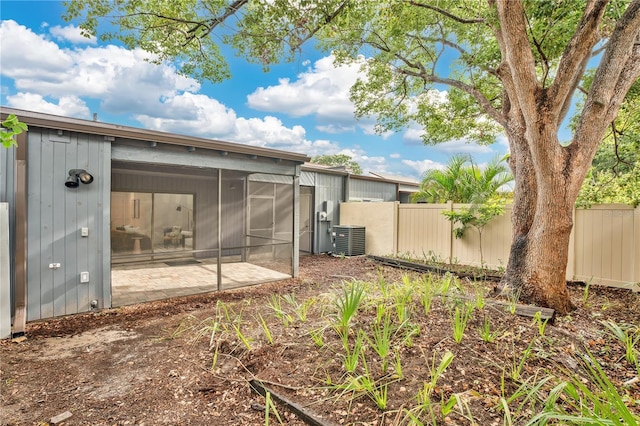 2541 Leeward Way, Winter Park, FL 32792 - back of property with cooling unit, a sunroom, and a patio area