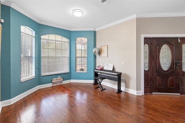 2017 W Gore St, Orlando, FL 32805 - foyer with wood finished floors, crown molding, and baseboards