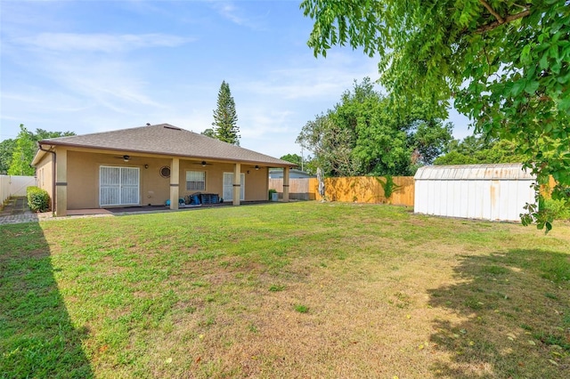 2017 W Gore St, Orlando, FL 32805 - view of yard featuring a ceiling fan, an outdoor structure, and a patio area