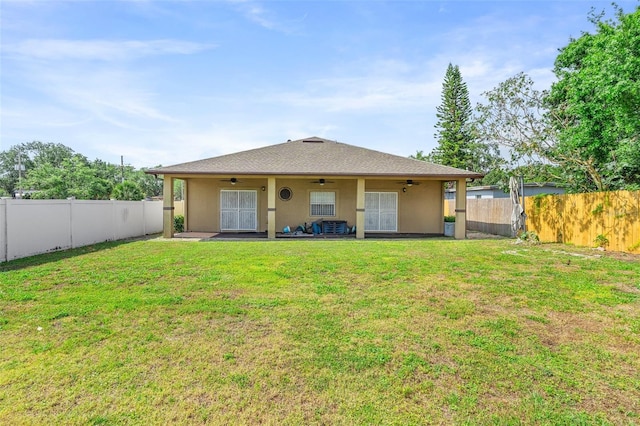 2017 W Gore St, Orlando, FL 32805 - rear view of house featuring a ceiling fan and stucco siding