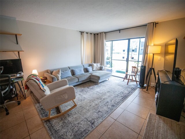 952 Courtyard Ln Unit 41, Orlando, FL 32825 - living room with light tile patterned floors