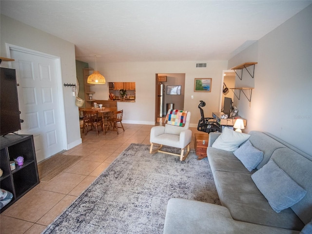 952 Courtyard Ln Unit 41, Orlando, FL 32825 - living area with light tile patterned floors and baseboards