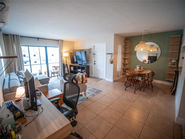 952 Courtyard Ln Unit 41, Orlando, FL 32825 - tiled living area with baseboards and a textured ceiling