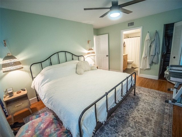 952 Courtyard Ln Unit 41, Orlando, FL 32825 - bedroom with wood finished floors, baseboards, connected bathroom, and a ceiling fan