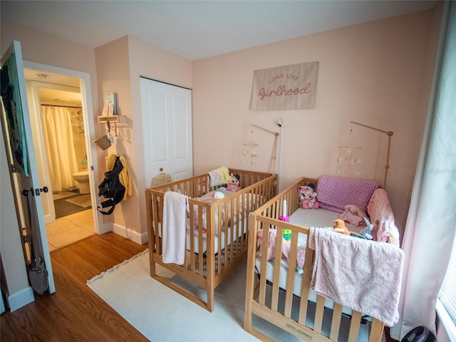 952 Courtyard Ln Unit 41, Orlando, FL 32825 - bedroom featuring wood finished floors and a closet