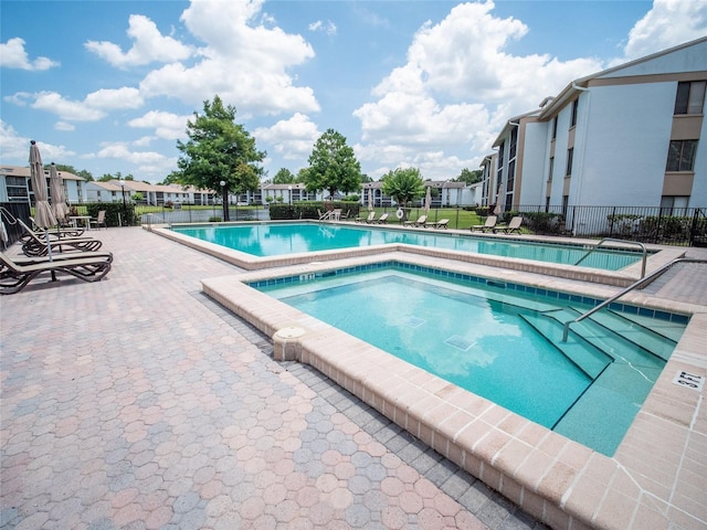 952 Courtyard Ln Unit 41, Orlando, FL 32825 - community pool with a patio and a residential view
