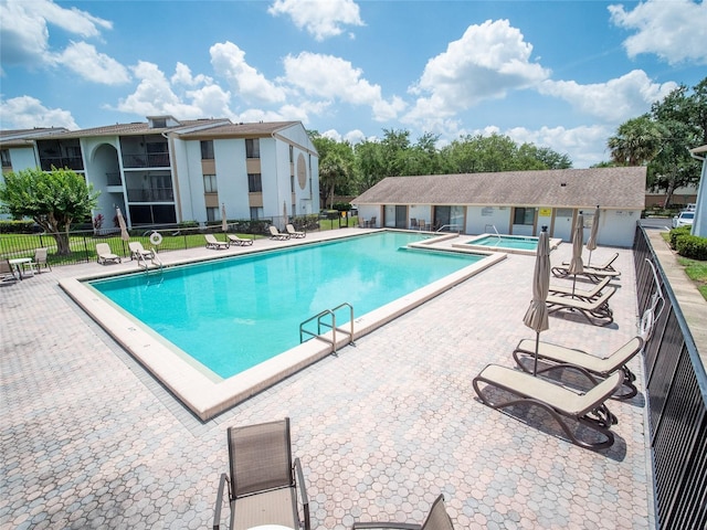 952 Courtyard Ln Unit 41, Orlando, FL 32825 - community pool with a patio area and a hot tub