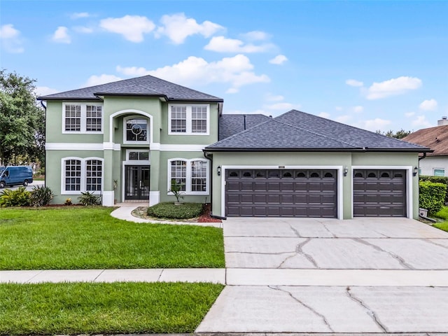 201 Hammock Dunes Pl, Orlando, FL 32828 - traditional home with an attached garage, concrete driveway, stucco siding, a front lawn, and roof with shingles