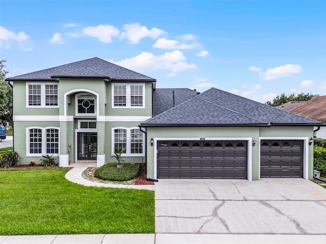 201 Hammock Dunes Pl, Orlando, FL 32828 - traditional-style house with an attached garage, concrete driveway, a front lawn, roof with shingles, and stucco siding
