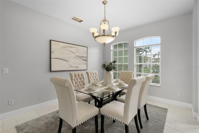 201 Hammock Dunes Pl, Orlando, FL 32828 - dining room with a chandelier, baseboards, and light tile patterned floors