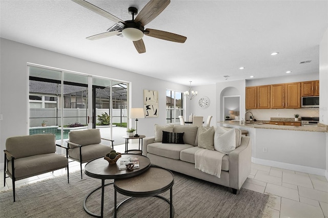 201 Hammock Dunes Pl, Orlando, FL 32828 - living area with recessed lighting, a chandelier, and a ceiling fan