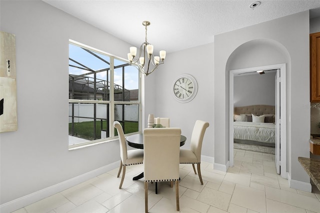 201 Hammock Dunes Pl, Orlando, FL 32828 - dining room with baseboards, healthy amount of natural light, and a chandelier
