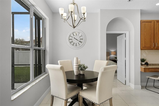 201 Hammock Dunes Pl, Orlando, FL 32828 - dining room with a chandelier and baseboards