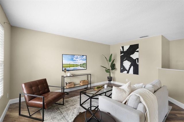 201 Hammock Dunes Pl, Orlando, FL 32828 - living room featuring baseboards and dark wood-type flooring