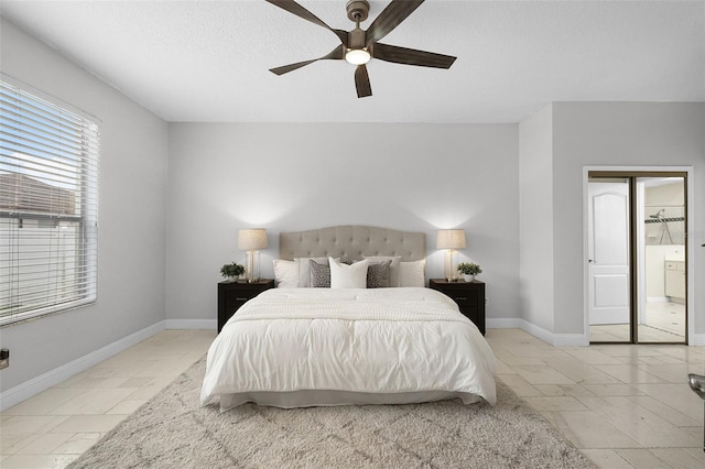201 Hammock Dunes Pl, Orlando, FL 32828 - bedroom featuring baseboards, a ceiling fan, and ensuite bathroom