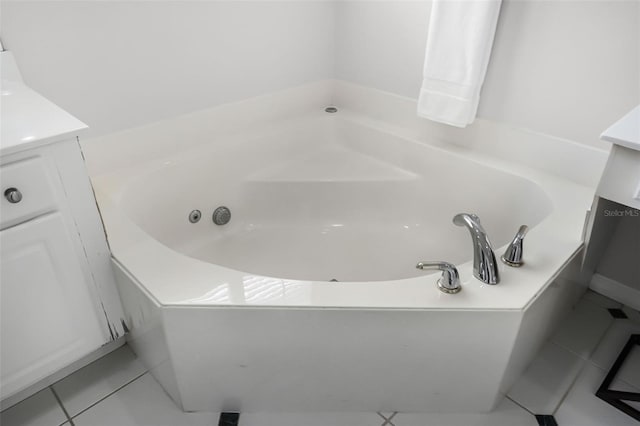 201 Hammock Dunes Pl, Orlando, FL 32828 - bathroom featuring tile patterned floors, a jetted tub, and vanity