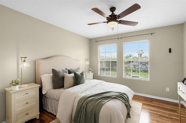 201 Hammock Dunes Pl, Orlando, FL 32828 - bedroom featuring dark wood-style flooring, baseboards, and ceiling fan