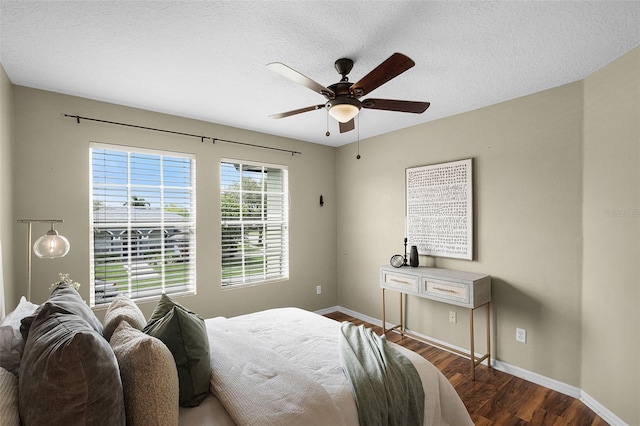 201 Hammock Dunes Pl, Orlando, FL 32828 - bedroom with wood finished floors, baseboards, a ceiling fan, and a textured ceiling