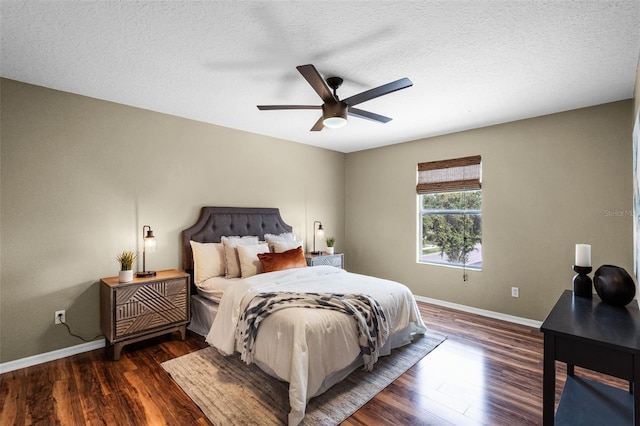 201 Hammock Dunes Pl, Orlando, FL 32828 - bedroom with baseboards, wood finished floors, ceiling fan, and a textured ceiling