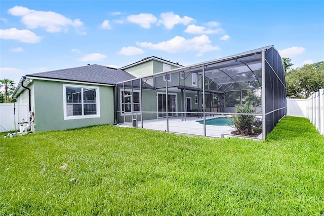 201 Hammock Dunes Pl, Orlando, FL 32828 - rear view of house with a patio, stucco siding, a lanai, and a shingled roof