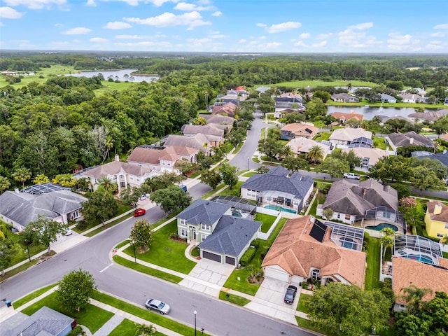 201 Hammock Dunes Pl, Orlando, FL 32828 - aerial view of residential area featuring a nearby body of water and a heavily wooded area