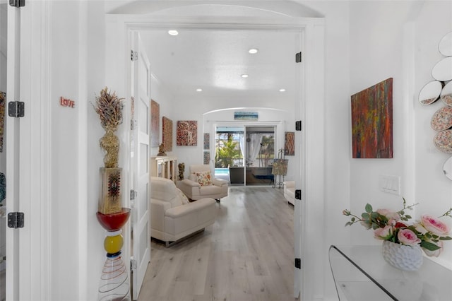 16120 Bristol Lake Cir, Orlando, FL 32828 - entryway featuring light wood finished floors, arched walkways, and recessed lighting