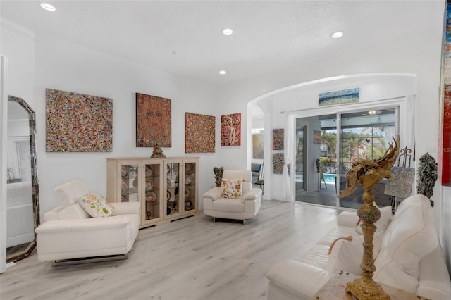 16120 Bristol Lake Cir, Orlando, FL 32828 - sitting room with arched walkways, light wood-type flooring, and recessed lighting