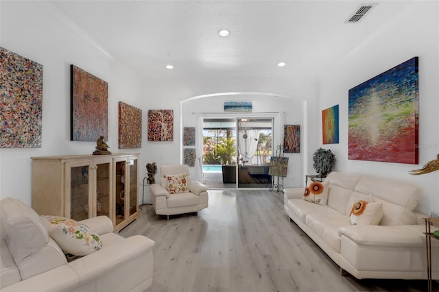 16120 Bristol Lake Cir, Orlando, FL 32828 - living room with arched walkways, wood finished floors, recessed lighting, and crown molding