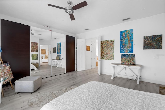 16120 Bristol Lake Cir, Orlando, FL 32828 - bedroom featuring wood finished floors, baseboards, and a ceiling fan
