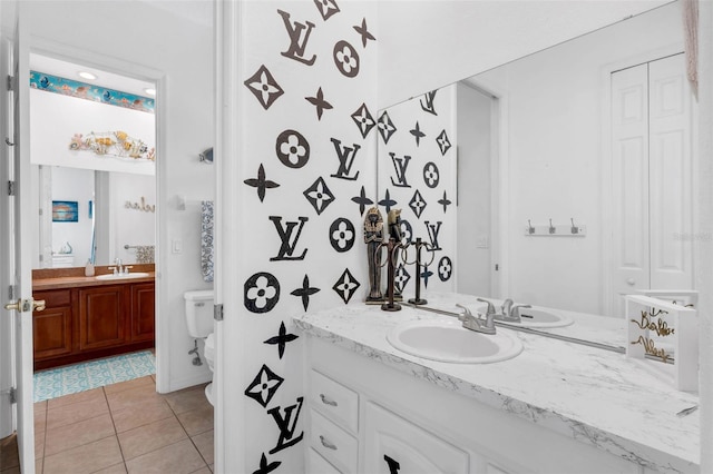 16120 Bristol Lake Cir, Orlando, FL 32828 - bathroom featuring vanity, tile patterned floors, and toilet