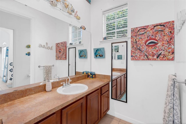 16120 Bristol Lake Cir, Orlando, FL 32828 - bathroom featuring vanity, tile patterned floors, and baseboards