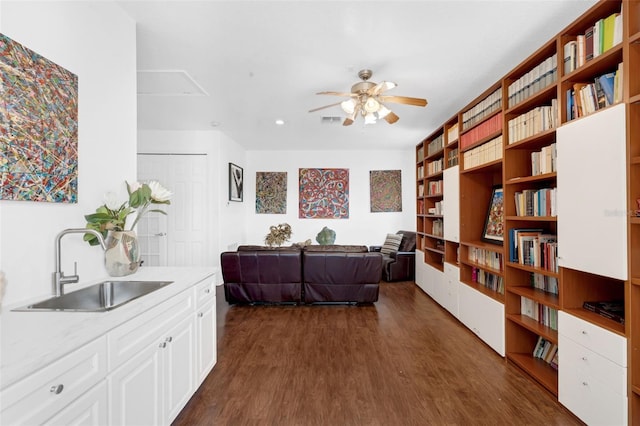 16120 Bristol Lake Cir, Orlando, FL 32828 - living room with ceiling fan and dark wood-style flooring