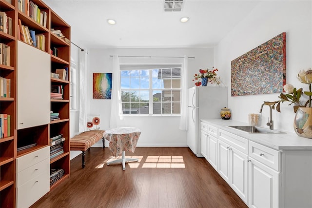 16120 Bristol Lake Cir, Orlando, FL 32828 - kitchen with a sink, open shelves, freestanding refrigerator, white cabinets, and recessed lighting