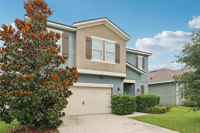 16440 Centipede St, Clermont, FL 34714 - view of front facade with stucco siding, an attached garage, concrete driveway, and a front yard